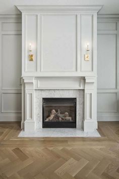 an image of a fireplace in the middle of a room with white walls and wood floors