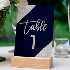 a table number sitting on top of a wooden block