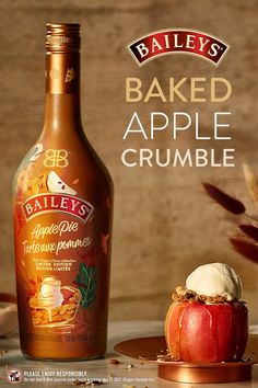 a bottle of bailey's baked apple crumble next to an apple slice