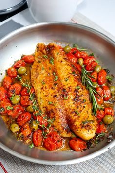 chicken with tomatoes and olives in a pan