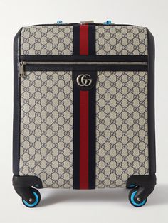 If you want to travel like the jet-set, a Gucci suitcase is the obvious choice. This 'Savoy' trolley is made from monogrammed coated-canvas, reinforced with full-grain leather trims and fitted with a convenient telescopic handle. It opens to a spacious interior with space enough for your in-flight essentials and a few outfits when you land. Designer Luggage For Trips, Designer Luggage With Sleeve For Trip, Designer Luggage With Sleeve For Travel, Designer Travel Cases With Luggage Sleeve, Luxury Rectangular Cases For Trip, Luxury Rectangular Travel Cases, Luxury Cases With Luggage Sleeve For Trips, Luxury Travel Cases With Luggage Sleeve, Luxury Travel Cases