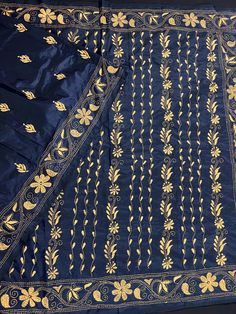 Gorgeous Midnight Blue color saree with handwoven Kantha stitch work in white color. The base of saree is in Midnight Blue color while the kantha work has been done in Raw Yellow color (Kachi Haldi Color) Item: SareeColor : Midnight Blue and Raw Yellow color (Kachi Haldi Color)Base Fabric: Bangalori Silk Blouse piece : YesBlouse material: Bangalori Silk Work: Handloom, Kantha Work Fall & Edging (Yes/No) : Yes Occasion: Party, Festival, Traditional, Religious, House-warming.Kindly note : Since th Indigo Traditional Wear With Chikankari Embroidery For Diwali, Indigo Traditional Wear For Wedding With Cutdana Details, Indigo Wedding Traditional Wear With Cutdana, Traditional Indigo Sets With Resham Embroidery, Festive Indigo Dupatta For Wedding, Unstitched Blue Traditional Sharara, Indigo Traditional Wear With Resham Embroidery For Wedding, Indigo Traditional Wear For Wedding And Navratri, Indigo Dupatta With Zari Work