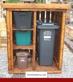 an outdoor storage area with trash cans and bins