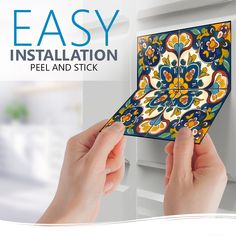 two hands holding an easy installation peel and stick tile