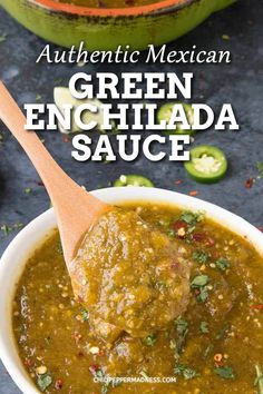 green enchilada sauce in a white bowl with a wooden spoon on the side