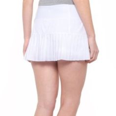 Anything Regular Shorts Can Do, Mondetta's Pleated Tennis Skort Can Do Better -- With Help From Quick-Drying, Stretchy Fabric And Built-In Shorts For Modesty And Coverage. Lightweight, Stretchy Fabric Blend Is Breathable And Quick Drying Integrated Stretch-Knit Shorts Flat Elastic Waistband Hidden Slip Pocket In Waistband Pleated Hem Made In Viet Nam Stretch White Pleated Bottoms, Stretch Pleated Short Bottoms, Pleated Stretch Bottoms In Short Length, Pleated Stretch Short Bottoms, Pleated Stretch Bottoms Short Length, White Stretch Pleated Bottoms, White Pleated Stretch Bottoms, Fitted Pleated Bottoms, Short Length, Fitted Pleated Short Bottoms