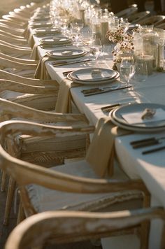 a long table is set with place settings