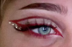 Makeup Ideas With Red Eyeliner, Red Eyeliner With Gems, Eyeliner And Gems Makeup, Red Eye Makeup Gems, Red Graphic Makeup Looks, Red Inspo Makeup, Red Album Makeup, Hot Red Makeup Look, Red And Black Concert Makeup