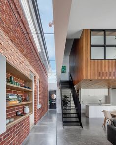 an open living area with brick walls and stairs