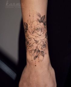 a woman's foot with a flower tattoo on it