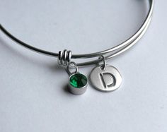 "Here is a beautiful custom May birthday (or any occasion) gift for anyone who loves charm bracelets. This is a stainless steel, triple loop bangle bracelet with a steel-set crystal  \"emerald\" birthstone charm along with a laser-cut stainless steel initial charm. Simple and beautiful. For Gemini,  Taurus, May birthdays. The bracelet is perfect for everyone because it comes in 4 sizes from child-size to large. All components are stainless steel and will never tarnish! Please see all photos, for Adjustable Metal Jewelry As Birthday Gift, Adjustable Metal Jewelry For Birthday Gift, Green Metal Charm Bracelet For Gift, Green Metal Charm Bracelet Gift, Nickel Free Stainless Steel Jewelry For Birthday Gift, Nickel-free Green Stainless Steel Jewelry, Adjustable Jewelry As Personalized May Birthstone Gift, Adjustable May Birthstone Jewelry For Personalized Gifts, Green Sterling Silver Charm Bracelet Gift