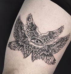 an owl tattoo on the thigh