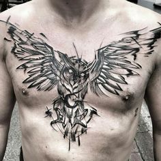 a man's chest with an owl tattoo on his chest and wings spread out