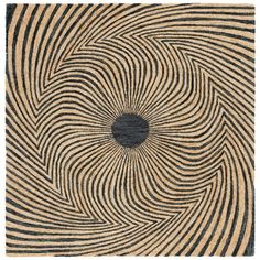 a black and white rug with an abstract design in the center on top of it