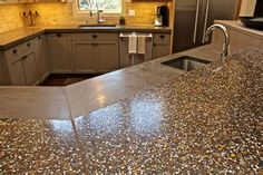 a counter top in a kitchen next to a sink