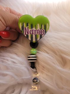 Beetle juice Halloween badge reel. Approximately 2" tall. Available with beads. Beads may Vary. Check out the super cute matching pen under pens. Badge reels are attached with 3M dual lock velcro and are interchangeable. If you prefer a permanent glue please send me a note when you purchase.  Care instructions: Please avoid dropping, while items are durable they are not indestructible. Please handle with care. Different colors available. Send me a message for customs. RETURNS/EXCHANGES: Due to all items being personalized and made to order we do not accept returns or exchanges. If there are any issues with your order you must notify us within 24 hours of delivery. Thank you! CHANGE OF ADDRESS: Please Double check your address as you are checking out. Themed Black Badge Reel Gift, Themed Black Badge Reel For Gifts, Themed Black Badge Reel For Gift, Themed Black Badge Reel As A Gift, Themed Black Badge Holders For Gift, Personalized Black Badge Reel For Personal Use, Customizable Black Novelty Badge Reel, Customizable Novelty Black Badge Reel, Novelty Black Badge Reel Customizable