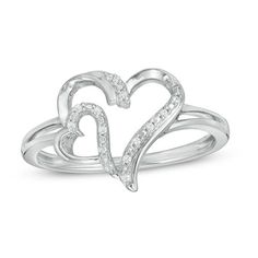 Sparkling with whimsy, this diamond heart ring suits her playful style. Created in sterling silver, this charming choice showcases a sculpted heart outline adorned with a smaller heart outline along one side - each artfully highlighted by shimmering diamonds. Captivating with 1/20 ct. t.w. of diamonds and a brilliant buffed luster, this design is certain to be adored. Custom-made to fit her ring size. Sterling silver rings cannot be resized after purchase. Valentine's Day Diamond White Sterling Silver Ring, Heart Shaped Sterling Silver Diamond Ring, Heart Cut Sterling Silver Diamond Ring With Accents, Silver Sterling Silver Heart-shaped Diamond Ring, Sterling Silver Heart Cut Diamond Ring With Accents, Silver Diamond Heart Ring For Valentine's Day, Silver Diamond Ring With Accents For Valentine's Day, Valentine's Day Diamond Heart Ring In Silver, Valentine's Day Silver Diamond Ring With Accents