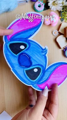 someone is making a paper cut out of the stitcher art character from lilpui