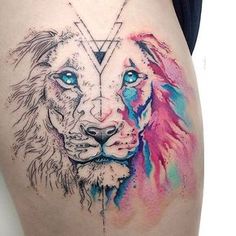 a tattoo on the side of a woman's thigh with an image of two lions