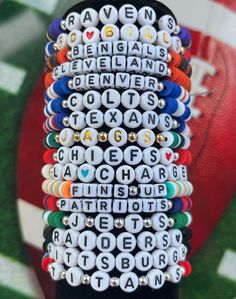 Handmade Bracelet-Ships from Upstate New York! 🏈Support your favorite NFL team with this personalized bracelet! 🏈This listing is for ONE bracelet, which includes clay beads matching your team's colors, white cubes with black letters, and two silver beads. Personalize it with any word or name you would like. 🏈For stack of 3 bracelets, please order through this link: https://www.etsy.com/listing/1745570066/kansas-city-chiefs-stack-bracelet-chiefs 🏈To order an all silver or all gold beaded bracelet to stack, please order through this link: https://www.etsy.com/listing/1749519192/goldsilver-bead-bracelet-gold-bead 🏈Standard letter beads are white with black lettering, either round or cube. Other letter options may be available such as white with gold or colored; feel free to inquire when Cheap Customizable Sports Bracelets, Cheap School Spirit Bracelets For Gifts, Cheap White Beaded Bracelets For Game Day, Sports Fan Accessories, Fan Bracelet, Team Bracelets, Football Bracelet, Stack Bracelet, Dallas Cowboys Football