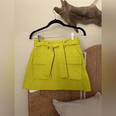 Brand: Zara Condition: Nwot Size: Small Style: Zara Utility Mini Tennis Skirt With Pocket And Tie Knot Belt Color: Lime Green - Yellow Ish Color Casual Yellow Zara Skirt, Green Skirt With Pockets For Day Out, Trendy Zara Mini Skirt With Pockets, Chic Yellow Mini Skirt For Day Out, Yellow Mini Skirt With Pockets, Trendy Yellow Mini Skirt For Fall, Chic Yellow Mini Skirt For Work, Zara Cotton Mini Skirt With Pockets, Zara Mini Skirt With Pockets For Spring