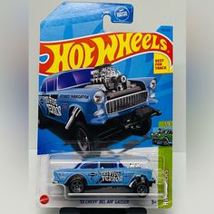 a blue hot wheels truck with an open hood on it's head and the words,