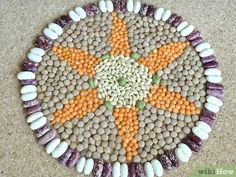 a plate made out of rocks and gravel with an orange star on it's center