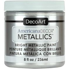 a jar of metallic paint sitting on top of a white tablecloth with the words, american decor metallics