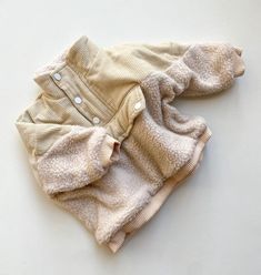 It’s time to get cozy with our Sherpa Pullover! Featuring a button down neckline with a hidden zip and a faux front pocket. A cord and teddy Sherpa outer and a super soft cotton lining. True to size but we suggest sizing up for a more oversized relaxed fit. Mom Accessories, Cream Jumper, One Piece & Sets, Baby Girl Boy, Mom Hairstyles, Sherpa Pullover, Linen Clothing, Milestone Cards, Top Baby Products