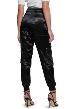 Luxurious textured satin lends a glam look to military-inspired cargo trousers fashioned in a slim silhouette with multiple flap pockets. Smocked cuffs   58% polyester, 42% recycled polyester   Hand wash, dry flat   Imported Satin Cargo Pants, Glam Look, Glam Looks, Trouser Style, Military Inspired, Sound Waves, Cargo Trousers, Jet Black, Flap Pocket