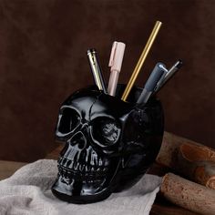 PRICES MAY VARY. 【MATERIAL】This skull pen holder is made of high quality resin，Each piece is hand-painted and polished individually.Highly detailed in surface, our skull pen holder with strong stability and high wear resistance. 【DESK STORAGE】It can be used not only as a pen holder and a makeup brush holder, but also for storing keys, cosmetics tool, etc. Helps to organize your desk and keep them clean and tidy. 【VERSATILE】This pen holder is very decorative and practical, simple design is ideal Goth Desk, Office Desk Supplies, Small Cactus, Makeup Brush Holder, Skull Makeup, Mini Succulents, Desk Supplies, Black Skull, Office Desk Decor