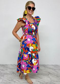 Make memories in this darling midi dress! Woven bright colored floral blooms shapes this dress featuring a scoop neckline, flutter cap sleeves, a tiered midi length and smocking from the waistline up. We all know that a great dress is the perfect option for a warm days and this one does not disappoint! Model is 5'8'' a Multicolor Maxi Dress With Smocked Back For Garden Party, Multicolor Midi Dress With Smocked Back For Garden Party, Multicolor Sleeveless Midi Dress With Smocked Back, Multicolor Midi Dress With Smocked Back, Summer Tiered Multicolor Midi Dress, Multicolor Tiered Summer Midi Dress, Multicolor Midi Dress With Smocked Back For Brunch, Vibrant Ruffle Dress For Brunch, Vibrant Ruffled Dress For Brunch