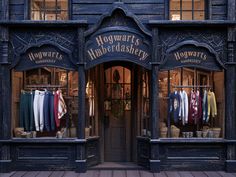 the front of hogwart's shop with clothes on racks and hanging out doors