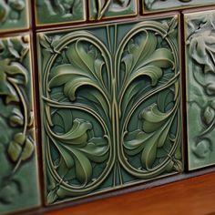 decorative tiles on the wall in an art nouveau style