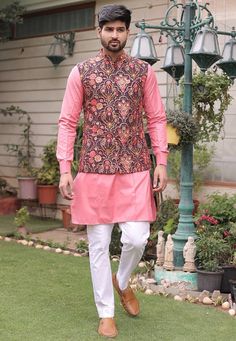 Cotton Silk Kurta in Pink. This Readymade attire is Enhanced With Fancy Buttons, Pockets, Mirror Effect, Resham, and Sequins Work. Crafted in Chinese Collar Neck and Full Sleeve Available with a Cotton Aligarhi Pant in White and a Faux Georgette Nehru Jacket with Satin Lining in Wine Do note: Footwear shown in the image is for presentation purposes only. Half to one inch may vary in measurement. (Slight variation in actual color vs. image is possible) We sell all kinds of menswear. Mens Kurta | Luxury Men's Pink Nehru Jacket, Footwear For Kurta Pajama Men, Pink Nehru Jacket With Zari Work For Spring, Spring Pink Nehru Jacket With Zari Work, Pink Traditional Wear With Floral Embroidery And Long Sleeves, Fitted Pink Nehru Jacket With Floral Embroidery, Cotton Nehru Jacket With Multicolor Embroidery And Zari Work, Cotton Nehru Jacket With Zari Work And Long Sleeves, Long Sleeve Nehru Jacket With Pallu For Winter