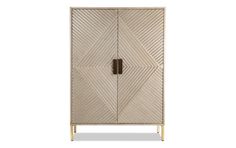 an armoire with geometric design on the front and side, in gold leaf pattern