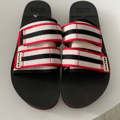 New Without Tags Hunter Black Red White Slide Sandal Shoe. Size 9-10 Us Size 7 Uk Red Open Toe Casual Flip Flops, Casual Red Open Toe Flip Flops, Summer Slides With Red Sole, Casual Sandals With Red Sole, Vacation Slip-on Sandals With Red Sole, Casual Black Sandals With Red Sole, Beach Slides With Red Sole And Round Toe, Casual Beach Slides With Red Sole, Casual Sandals With Red Sole And Flat Heel