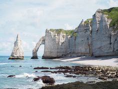 two large rocks sticking out of the ocean