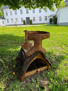 an old rusty stove sitting in the grass