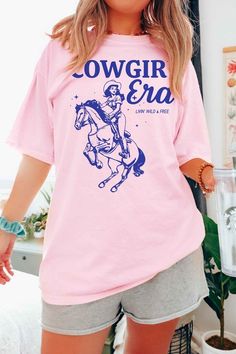 COWGIRL ERA WESTERN GRAPHIC T-SHIRTPREMIUM COTTONUNISEX SIZINGCLASSIC FITMade In: USAFabric Contents: 100% Cotton Cowgirl Era, Western Graphic Tees, Pink Sand, Dress Jewelry, Shoe Sale, Baby Shop, Graphic Tee, Graphic Tees