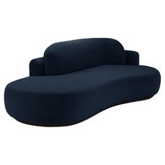 a blue couch sitting on top of a white floor