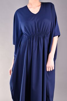 "Beautiful chic caftan in navy blue colour. The model's loose fit cut with kimono sleeves and the gathered bust area hide the flaws and flatter the top part of the body. The blue maxi dress is a top choice for plus size women who want to look elegant and stylish no matter of their size. Match it with flats for a more casual look or with heels for an evening occasion. ^ Sizes: The item can be made in sizes from XXS to 7XL. Please, use the size chart below or if you are not sure about your size, j Elegant Blue Tunic Maxi Dress, Chic Blue Dresses With Kimono Sleeves, Blue Tunic With Kimono Sleeves, Blue Summer Evening Kaftan, Elegant Blue Beach Tunic, Chic Blue Dress With Kimono Sleeves, Chic Blue Tunic Kaftan, Chic Blue Maxi Length Kaftan, Flowy Blue Maxi Length Kaftan