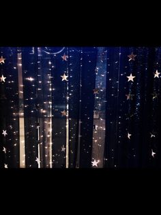 the curtain is decorated with stars and sparkles