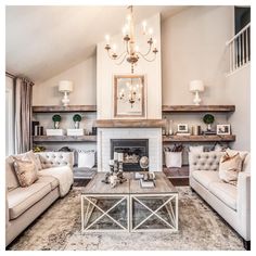 a living room filled with furniture and a fire place