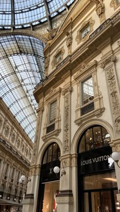 the entrance to louis vuitton store in paris, france with its glass ceiling