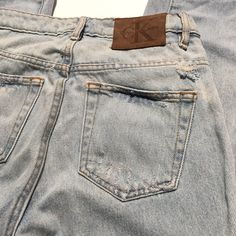 "Worn in vintage condition Distressed and faded in nicely Holes and discolorations around jeans(see photos) Ck Calvin Klein denim Size 24 on tag Please review measurements to ensure a proper fit and do not rely on the tag for sizing Waist:13.5\" Rise:10\" Inseam:26\" Hips:16\" Thigh:8\"" Faded Washed Cutoff Jeans, Acid Wash Denim Cutoff Jeans, Acid Wash Distressed Cutoff Jeans, Acid Wash Distressed Mid-rise Jeans, Fitted Cutoff Faded Jeans, Fitted Faded Cutoff Jeans, Faded Denim Grunge Jeans, Faded Grunge Denim Jeans, Vintage Denim Jeans With Frayed Hem