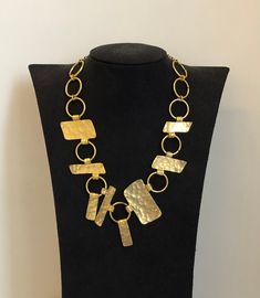 Vintage Dolce Vita 1970 - 1980 necklace / hammered golden metal / good condition despite some wear on the gold to clean / dimension in the photo / unique and original necklace / sewing / ideal for a gift or for a super modern look https://antiquairesdesmodes.com Collier vintage Dolce Vita 1970 - 1980 / métal doré martelé / bon état malgré quelques usures sur l'or à nettoyer / dimension sur la photo / collier unique et original / couture / idéal pour un cadeau ou pour un look hyper moderne Gold Necklace 16 Inch For Party, Gold-tone Plated Metal Chain Necklace, Gold-tone Hammered Metal Necklace, Gold-tone Necklace With Large Pendant, Gold-tone Brass Necklace With Large Pendant, Hammered Gold-tone Necklace Gift, Hammered Gold-tone Necklace For Gift, Gold Necklace With Large Pendant For Party, Gold-tone Metal Necklace With Large Pendant