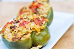 two stuffed peppers on a white plate