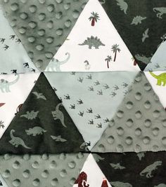 an image of dinosaurs and dinosaurs on fabric