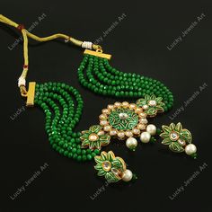 This is a stunning handmade choker necklace perfect for high end Jewelry Collector, a keeper in Traditional Vintage Indian/Pakistani Bridal jewelry and a Luxury Gift for your Daughter, Sister or Wife on Wedding or Anniversary. Perfect for any type of occasions, weddings And celebrations and a beautiful & memorable gift for weddings and special occasions. Description  Item Code:- L Gold Plated Fine Kundan & Green Beaded Choker Necklace Necklace Measures- Adjustable with a Dori/Cord Earring Measures- 35x20mm approx Quantity- One Necklace Set Please see more different designs here:- https://www.etsy.com/in-en/shop/LUCKYJEWELSART?ref=seller-platform-mcnav I make every item of my collection with a lot of love and care, I pay attention to every detail.  You are more than welcome to contact me fo Luxury Handmade Choker For Celebration, Luxury Kundan Necklace As Fine Jewelry Gift, Luxury Green Kundan Necklace For Wedding, Luxury Green Pearl Necklace As Gift, Luxury Green Kundan Necklace For Anniversary, Luxury Designer Green Kundan Necklace, Luxury Kundan Pearl Earrings Gift, Green Kundan Beaded Necklace Gift, Luxury Green Beaded Bridal Necklace